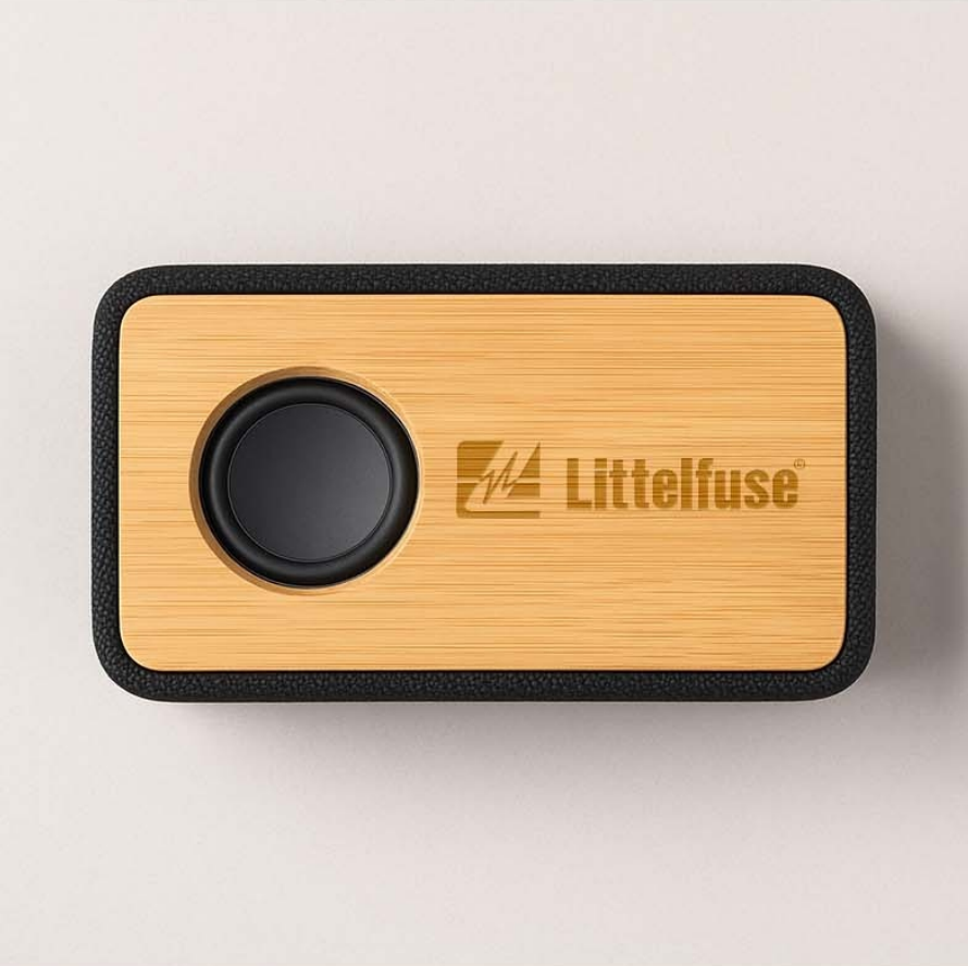 Bamboo-faced portable Bluetooth speaker engraved with the Littelfuse logo